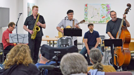 Group of Five Men playing Jazz in white room