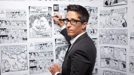 Comic Illustrator Writer Drawing Looks into the Camera