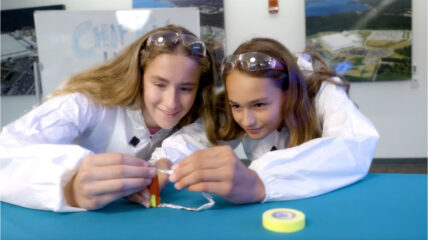 Light It Up! Two students work on a circuit at a lab table