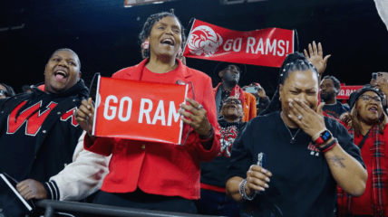 A crowd cheers the RAMS basket ball team