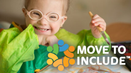 Child with glasses smiles while painting. Move to Include