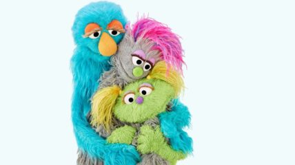 Muppet family hugging each other