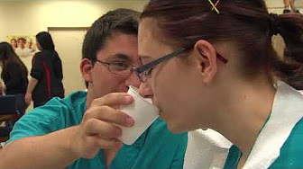 Student Nurse Practicing Assisting a Patient