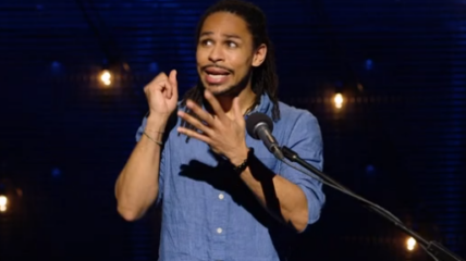 Brandon tells his story from the stage of using ASL to bridge a communication gap.