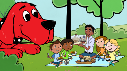 Clifford the Big Red Dog and friends reading at a picnic out of doors
