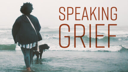 Speaking Grief Photo of young person and dog walking down the beach