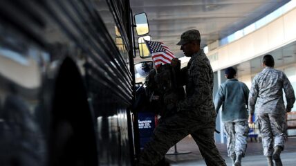 Soldier Getting on A Bus