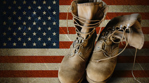 Military Boots with American Flag in the Background