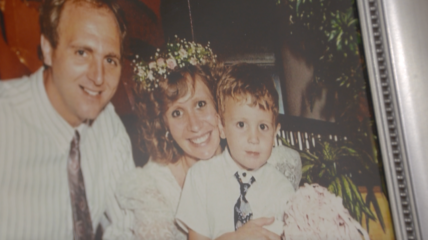 Photo of a family in a frame off center and faded.