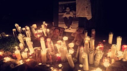 Photos and candles of those being remembered