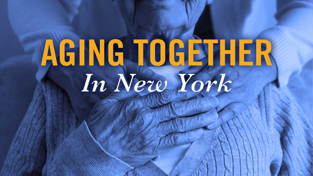 A woman standing behind a senior man embraces him and he holds her hands. Title Reads Aging Together In New York