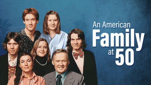 A white family posing together - a mom, dad, two daughters and three sons