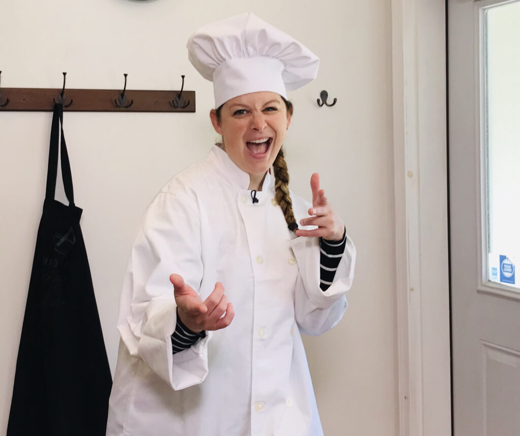 Jen in a chef hat