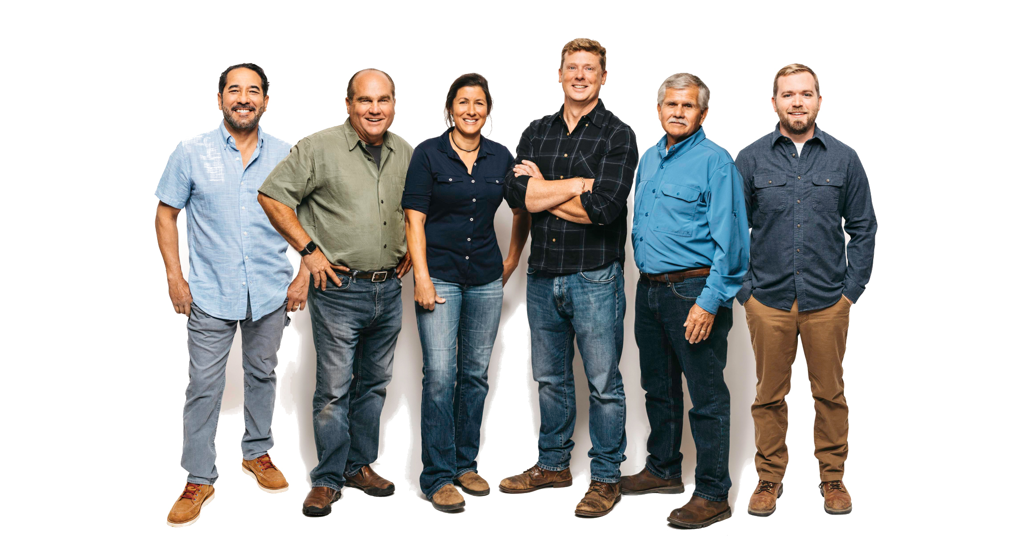 Six people standing together - five men and one woman all wearing jeans and button down collared shirts