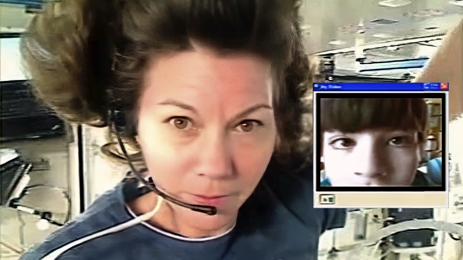 A white female astronaut with short brown hair wearing a head set.