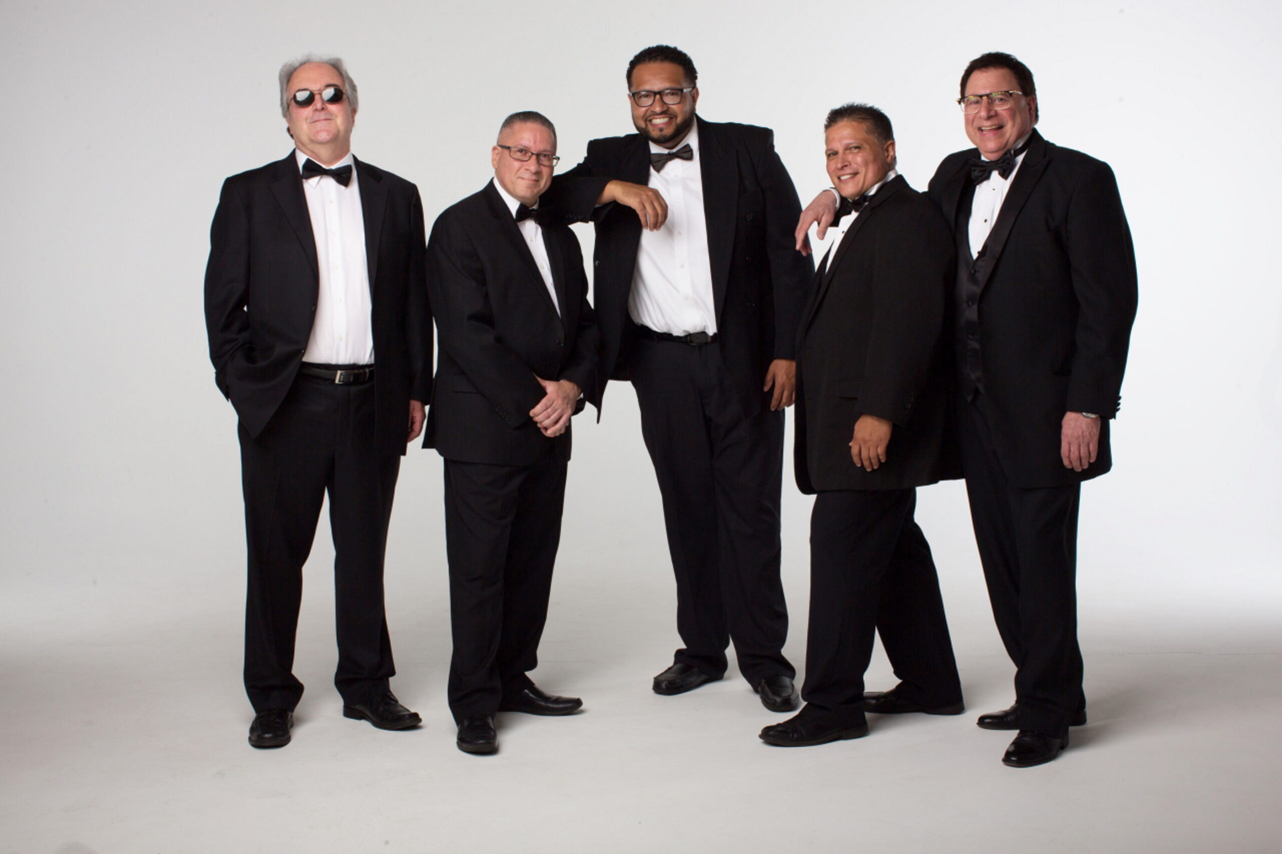 Group of 5 men in tuxedos