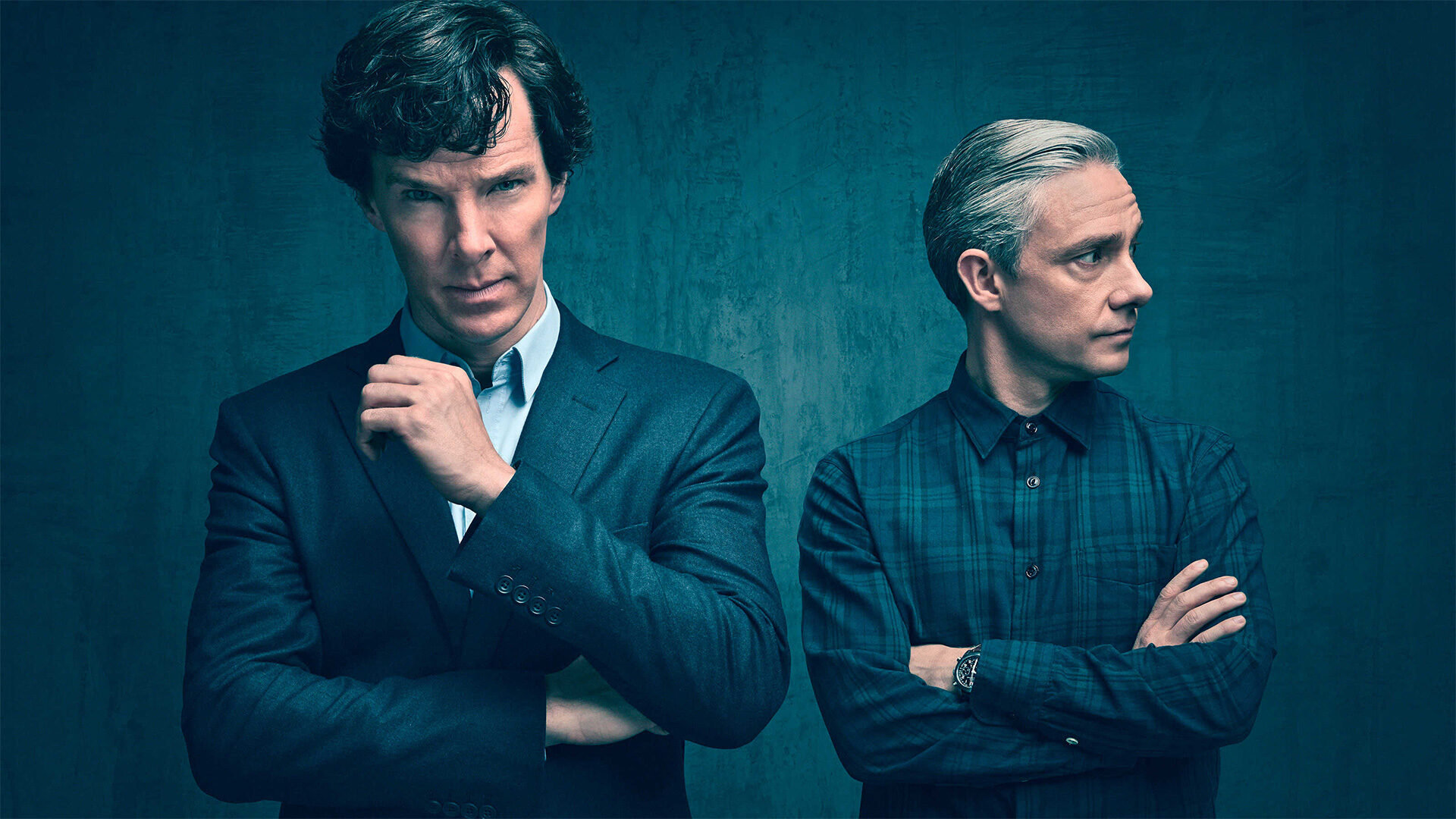 Benedict Cumberbatch and Martin Freeman stand side by side