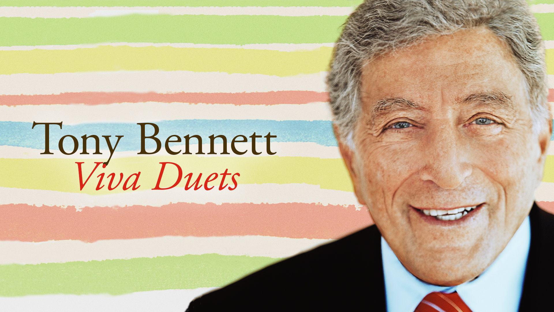 Tony Bennett in front of a stripped background of green, yellow. pink and blue.
