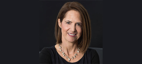 Lynn Novick wearing a Black dress and a silver necklace.