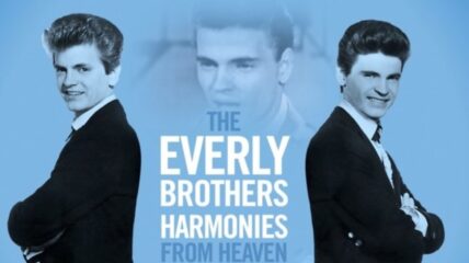 The Everly Brothers stand side by side