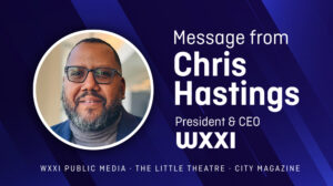 WXXI President Chris Hastings wearing a blue blazer and gray turtleneck