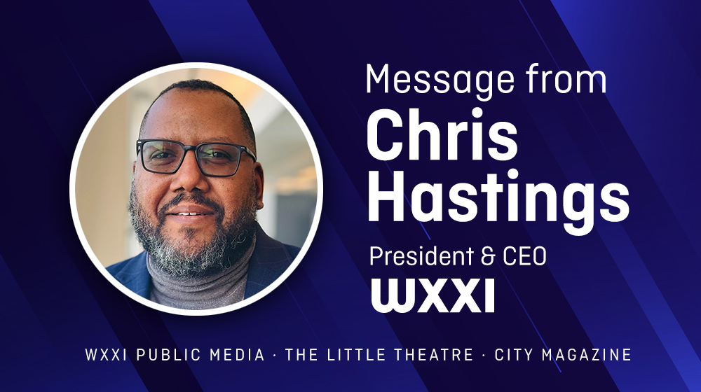 WXXI President Chris Hastings wearing a blue blazer and gray turtleneck
