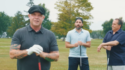 Three guys on a gold course holding clubs