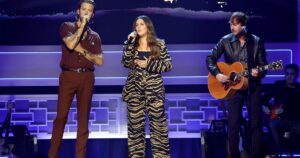 Charles Kelley, Hillary Scott, and Dave Haywood performing on stage.