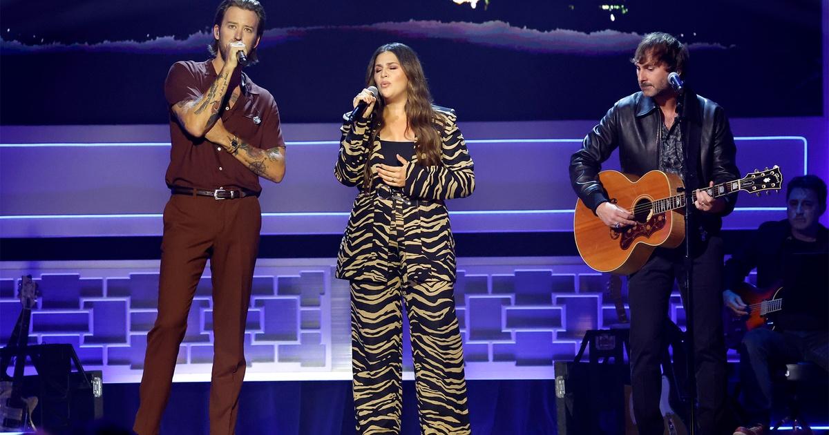 Charles Kelley, Hillary Scott, and Dave Haywood performing on stage.