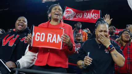 A crowd cheers the RAMS basket ball team