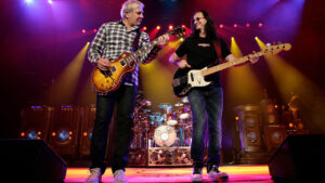 Geddy Lee and Neil Peart on stage performing