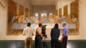 Rick Steves and crew taping in front of Leonardo da Vinci's The Last Supper