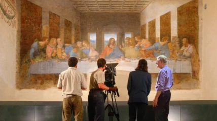Rick Steves and crew taping in front of Leonardo da Vinci's The Last Supper