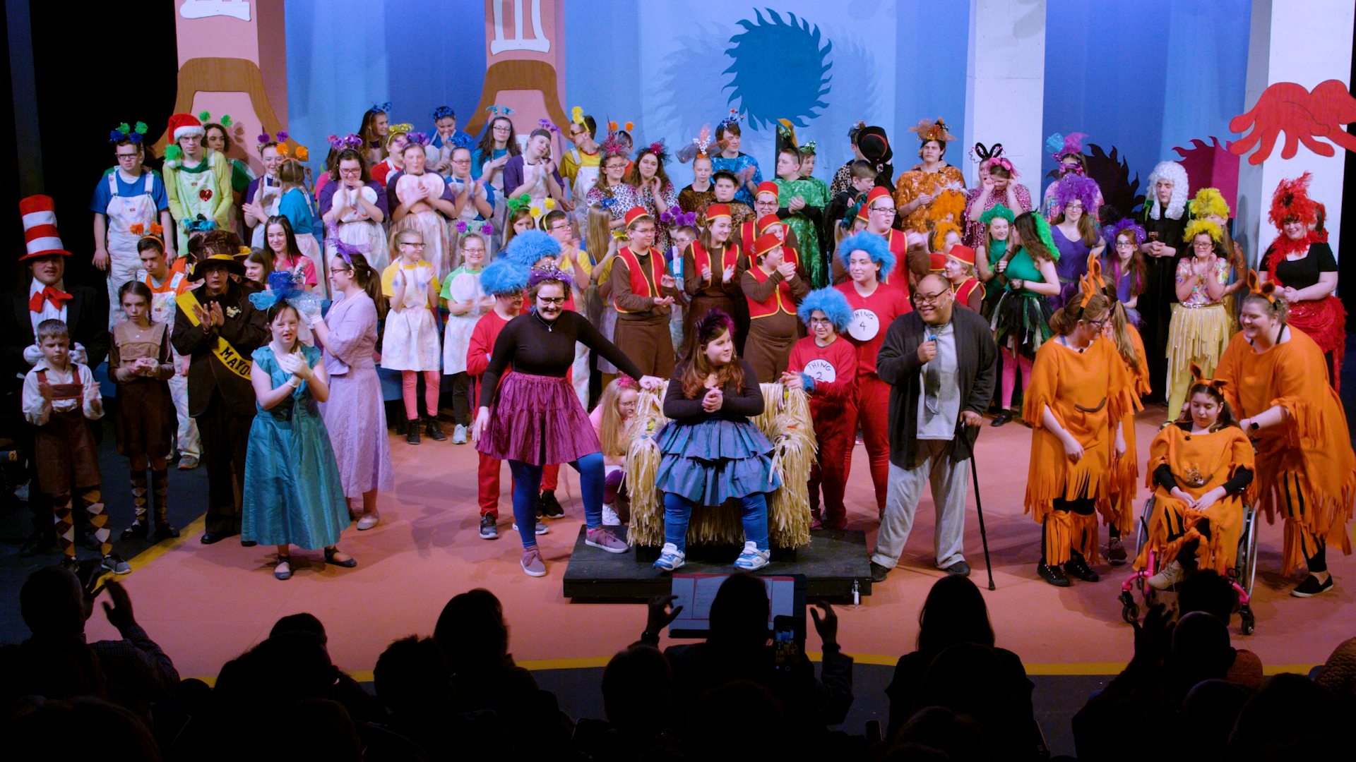 A group of kids on stage acting out a play.