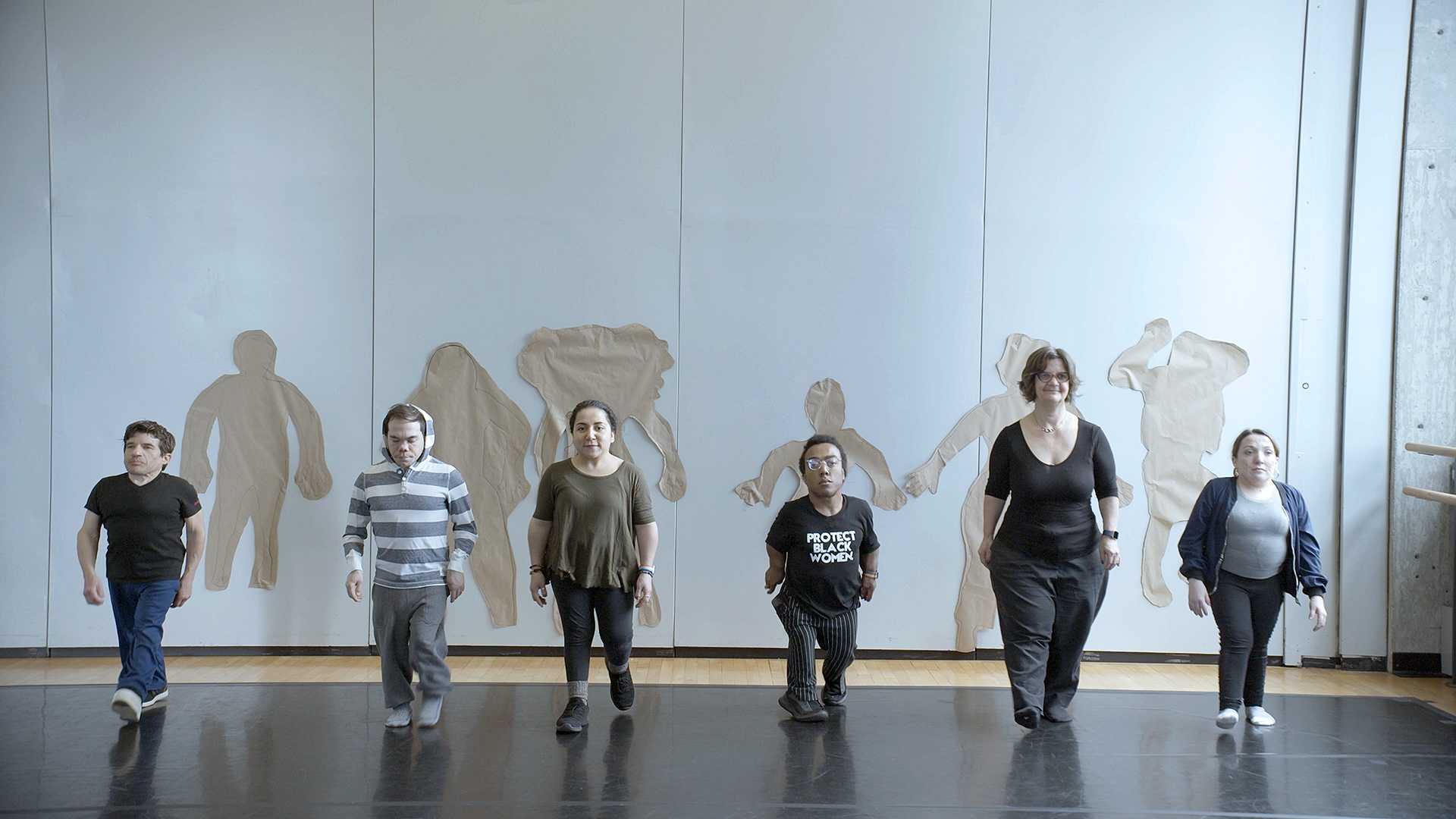 Little People in a dance studio standing in a line