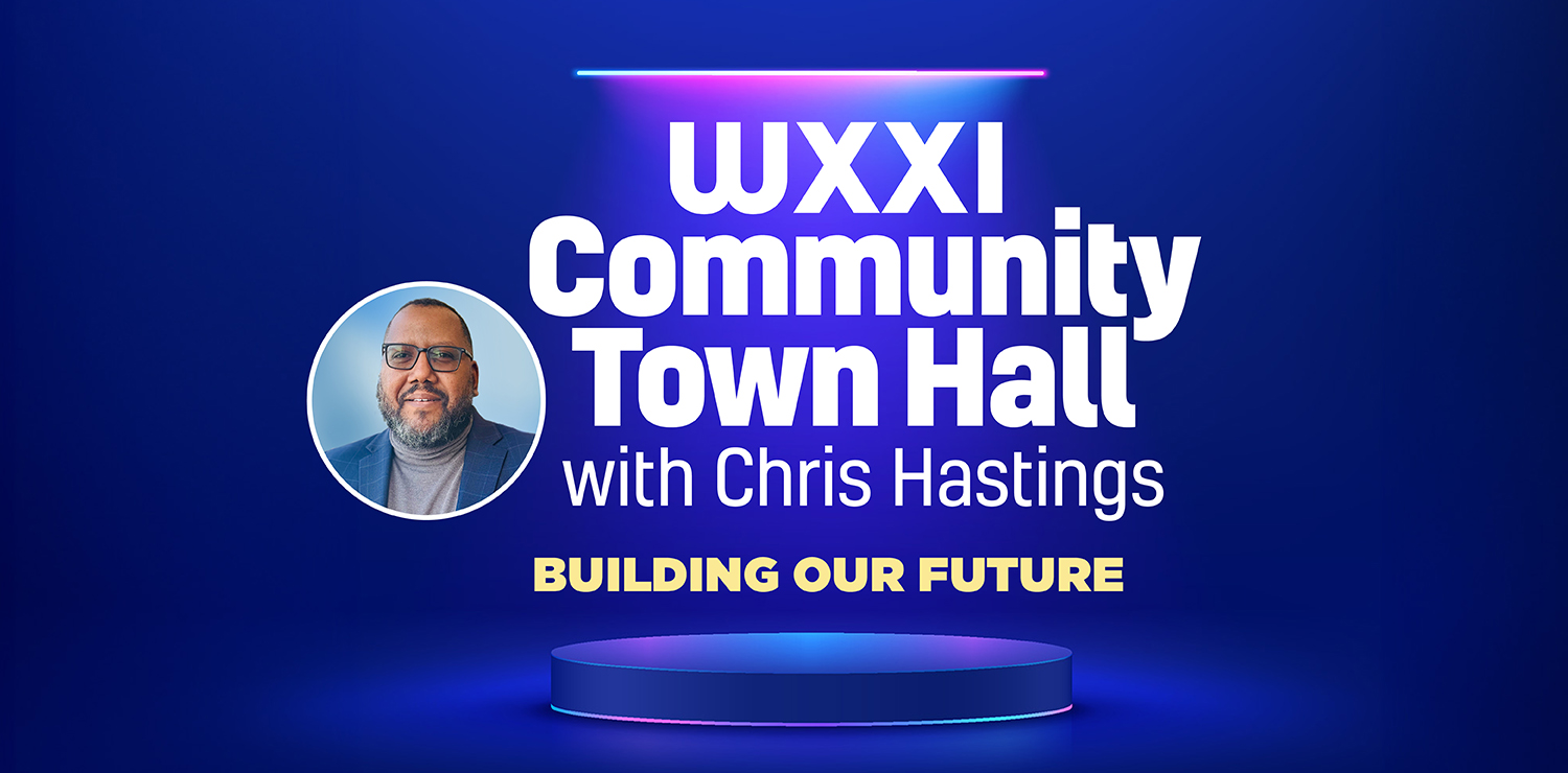 WXXI President Chris Hastings wearing a gray shirt and blue blazer with copy in white text on a blue background that reads: WXXI COMMUNITY TOWN HALL with Chris Hastings Building our Future