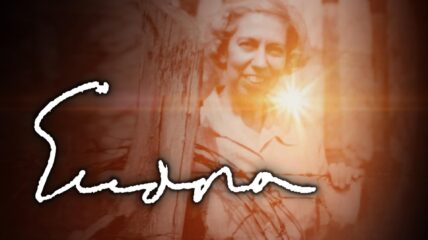 A white elderly woman with gray hair wearing a dress. The sun is shining behind her. Copy in white reads Eudora