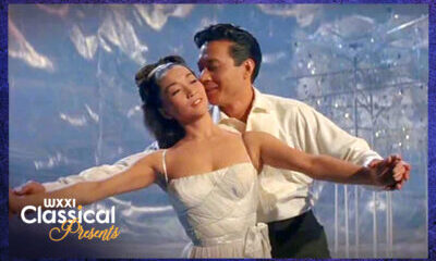 An asian man and woman dancing