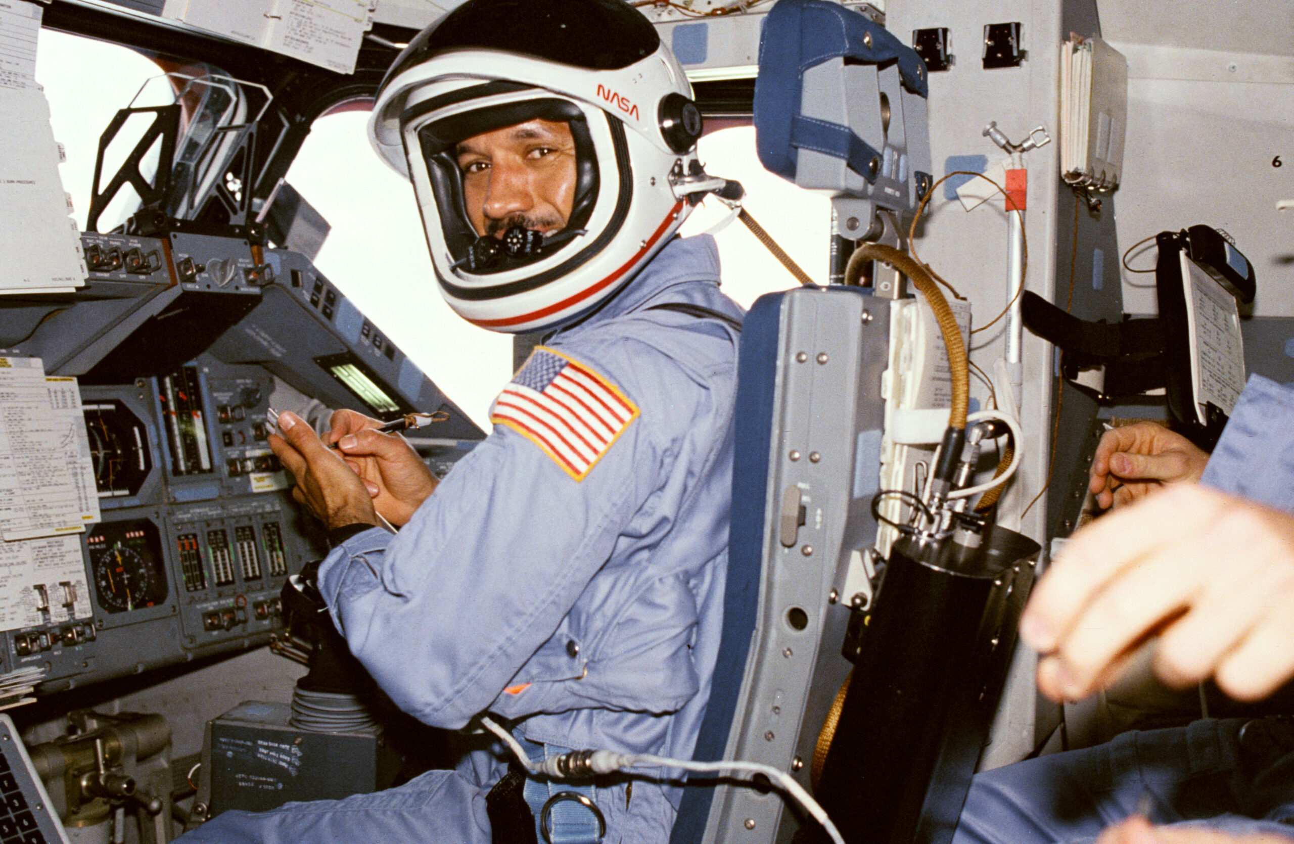 Charles Bolden mans the pilot's station on Columbia's flight deck prior to re-entry during mission STS-61-C.