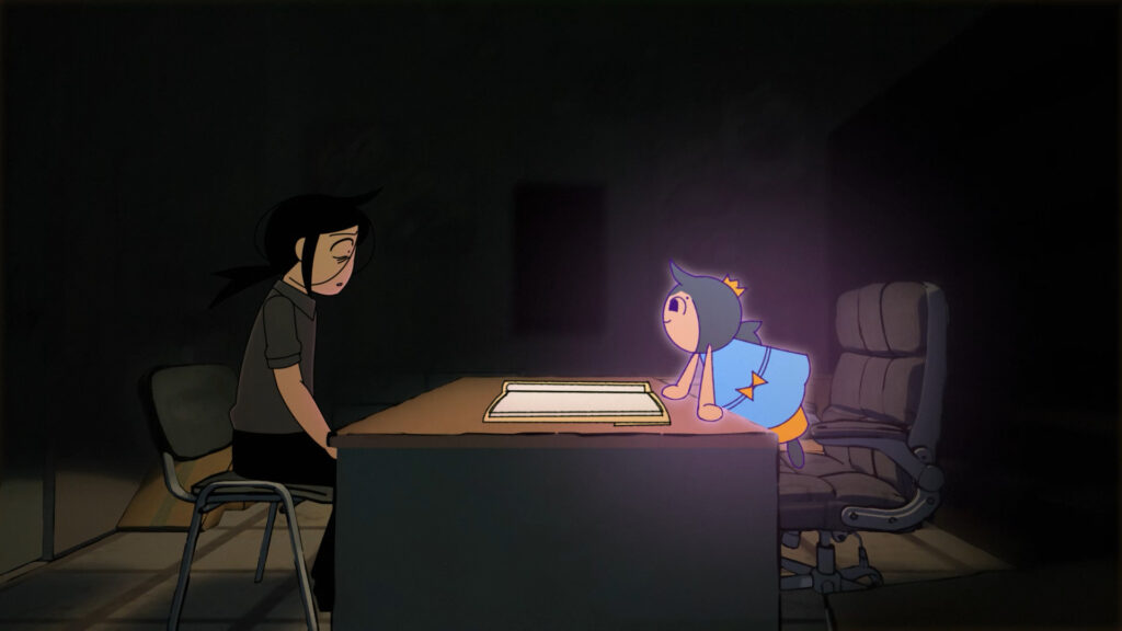 A little girl wearing a blue dress sits across from her grown-up self wearing a Black dress. They are sitting at a desk and there is an opne book on the desk.